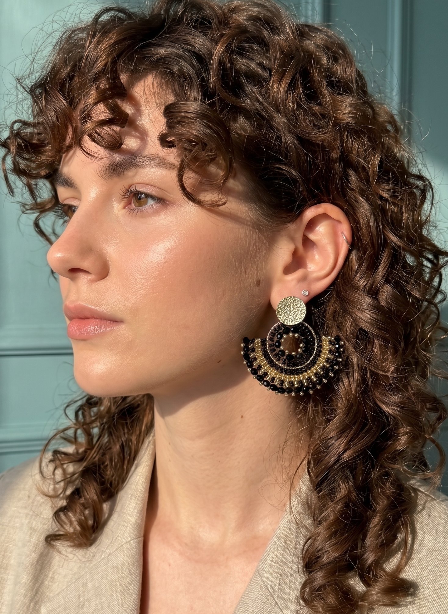 Woman with black beaded earrings