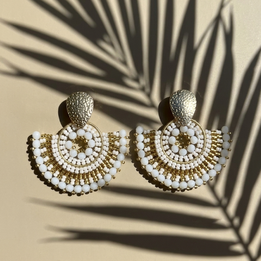Image with white earrings with a palm shade