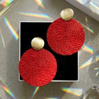 Red woven earrings with reflections