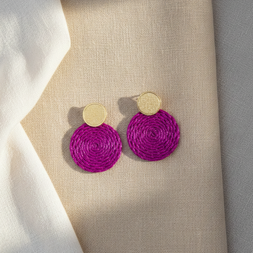 Magenta round textile earrings on linen