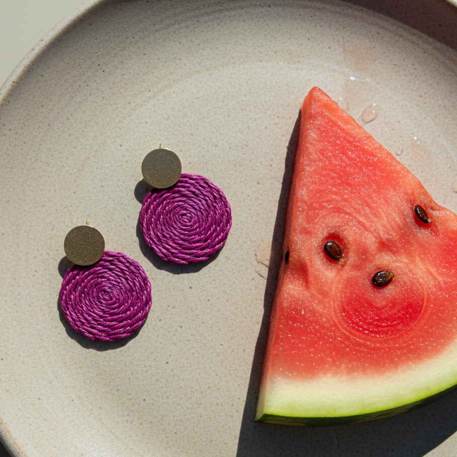 Round earrings in plum with a watermelon slice